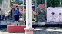 Sekretaris Daerah Kabupaten Minahasa, Dr. Lynda D. Watania, yang bertindak sebagai pembina upacara sekaligus membacakan sambutan Menteri Komunikasi dan Digital Republik Indonesia, Meutya Viada Hafid (ist)